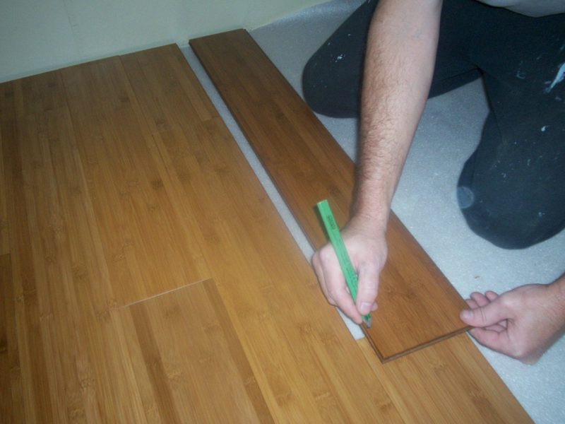 Flip the board around and make your mark. Use the left over cutoff piece - when it's long enough - to start the next row. It's that simple!