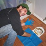 Author Eric Brennan removing a wax ring