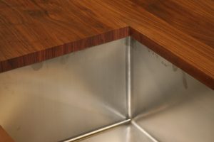 Sink cutout of engineered wood counter top Sink cutout of engineered wood counter top