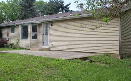 Before - this wall and backyard are looking pretty bland