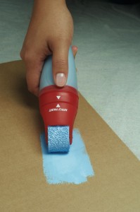 Load the roller on a scrap piece of cardboard before you begin