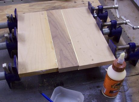 Plenty of glue, well jointed edges and of course copious amount of clamping pressure.