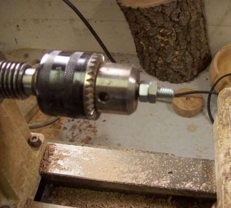 A simple mandrel made from a hack sawed 5/8 carriage bolt and a couple of nuts.
