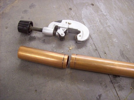 Cutting the pipe is a breeze with a pipe cutter, but if you don't have one a hacksaw will work too.
