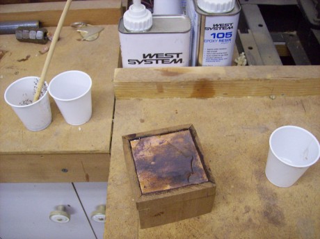 2 part epoxy will give a glossy shine to the copper an protect if from further oxidation.