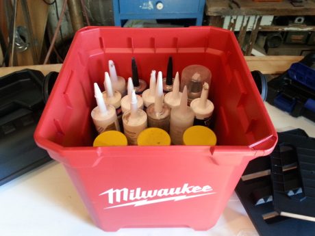The locking lid keeps caulk tubs from rolling all over the truck.