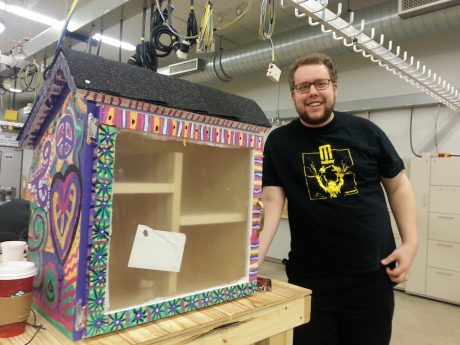CJ and one of his Little Free Libraries.