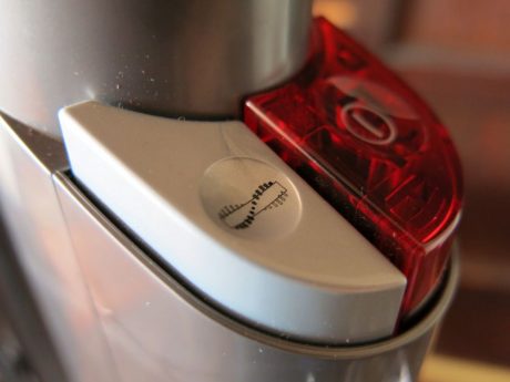 Red equals power. Grey turns on and off the spinning agitator brush.