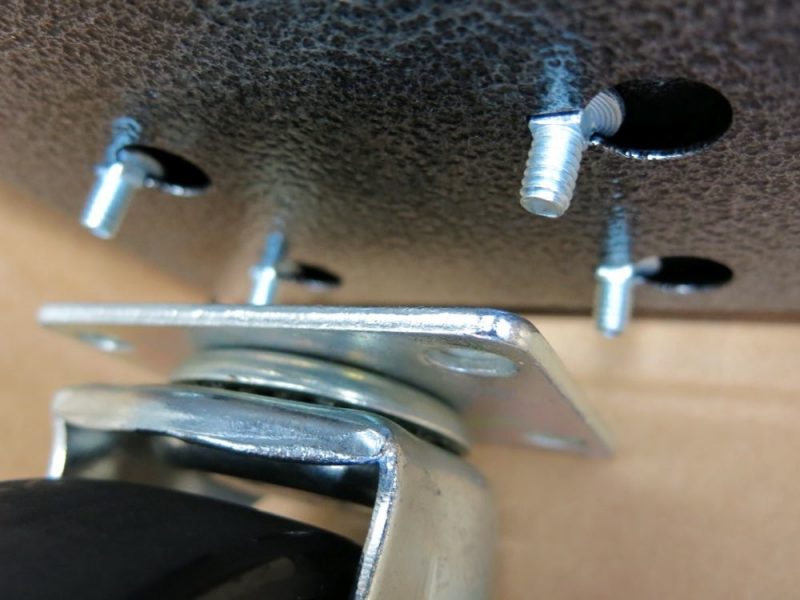 Line up the heavy-duty casters making sure the swivel casters are on the side you'll be installing the handle on