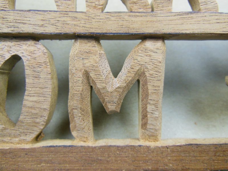 Carved "M"