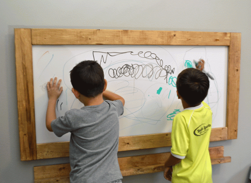 kids playing chalkboard