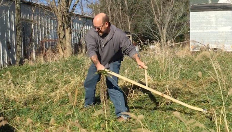 Mowing a banked ditch takes practice! A shorter blade helps...