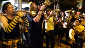 Marching band entertaining crowd.