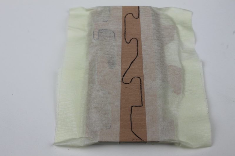Taped together for stack cutting.