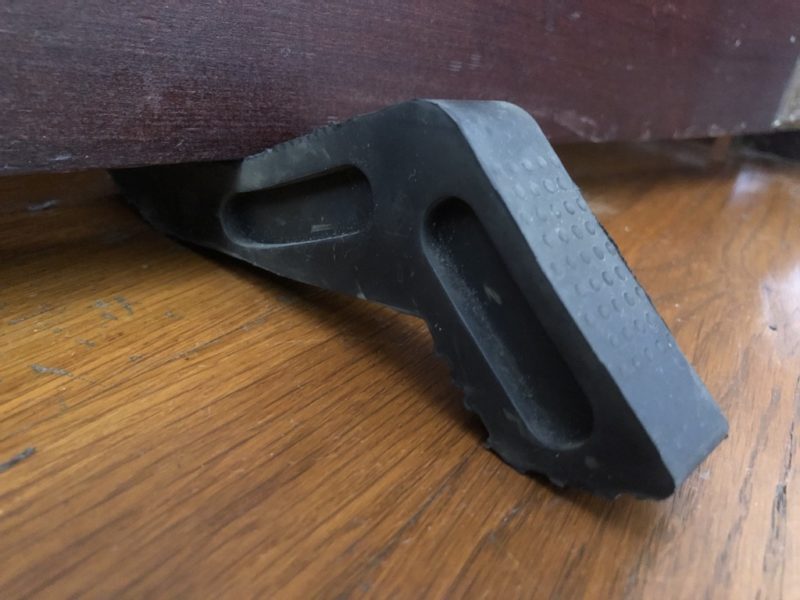 rubber door stopper under swinging door