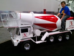 kid on model concrete truck