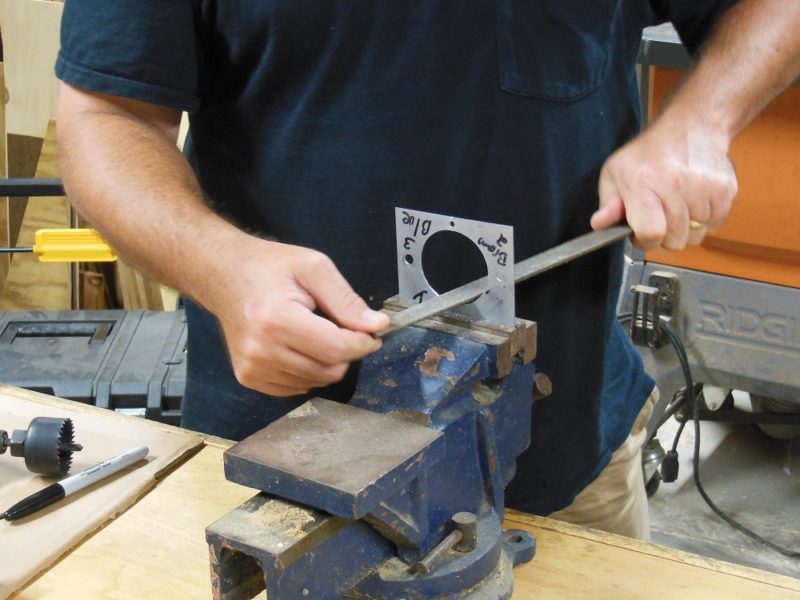 Enlarging the mounting hole.