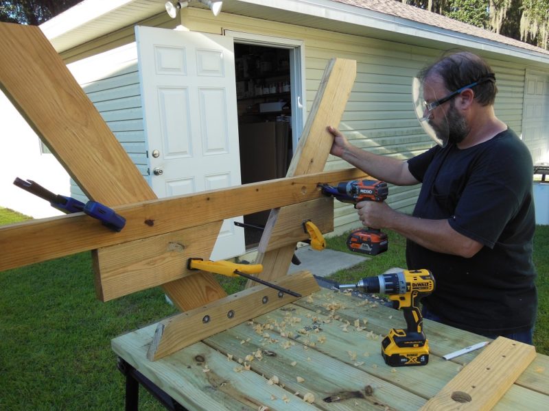 Fasten bench supports in place.