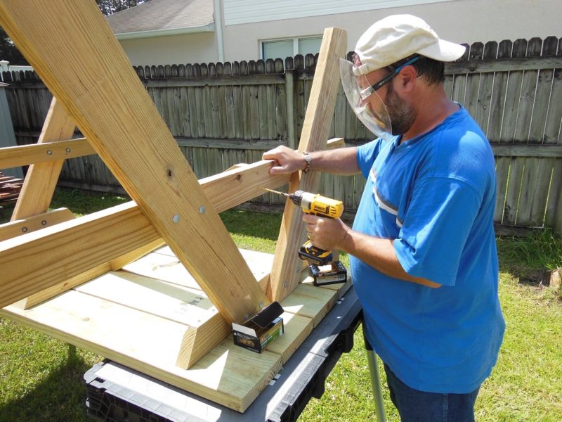 Fasten brace to bench support.