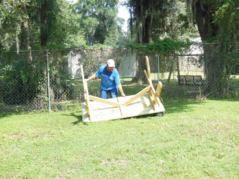 Rolling the table upright.