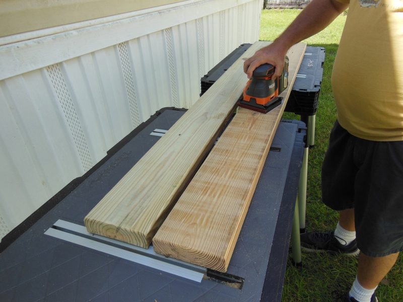 Sanding bench slats.