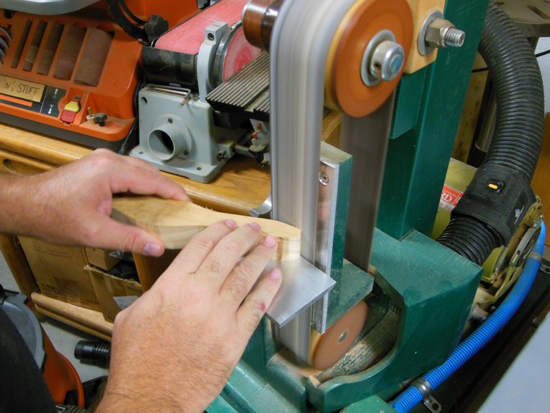 Shaping with a vertical belt sander.