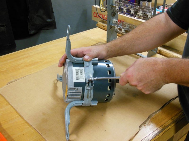 Unstrap the motor.