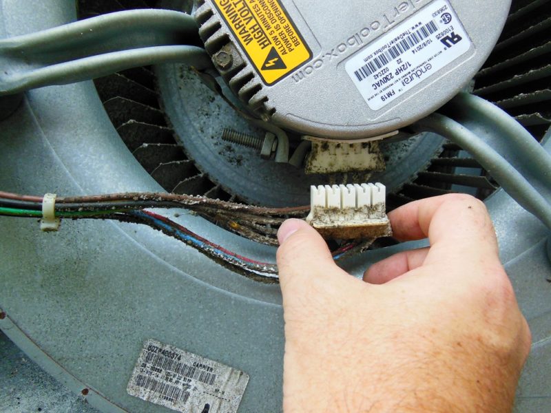 Disconnecting the blower motor.