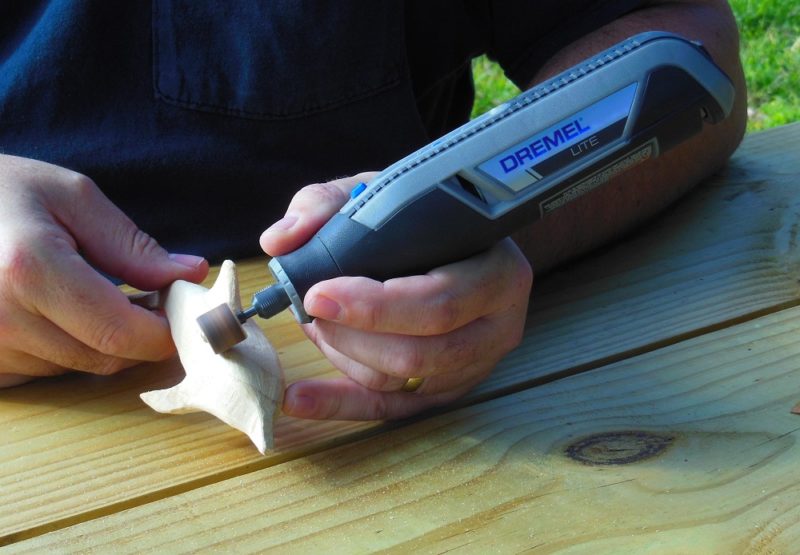 Dremel Lite with a sanding drum.