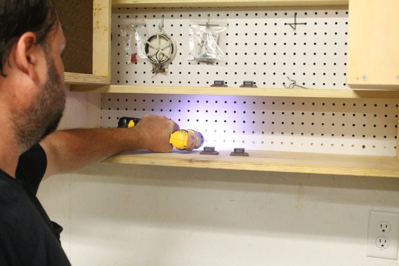 Securing the cabinet to the wall.