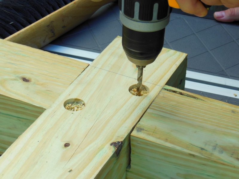 Drilling pilot holes.