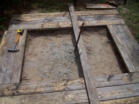 I used the 2x4 to help keep the stake at the right angle until it dried