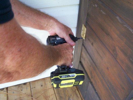 My dads using the Kobalt 20-Volt Impact Driver to attach a hinge to his outdoor kitchen