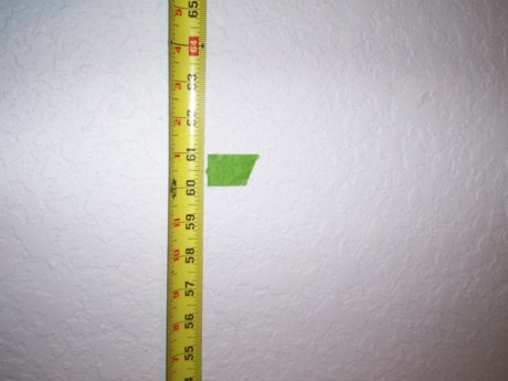 I measured up the wall and thought 57" looked a little too low so I raised mine to 61"