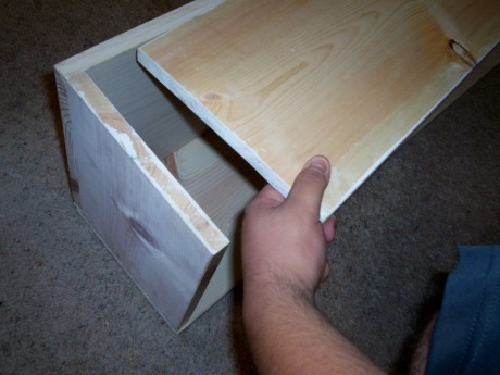 Here you can see the 1x10 going on top of the 1x12 to make the cubby. I used an end and center piece to hold it together while I nailed it.
