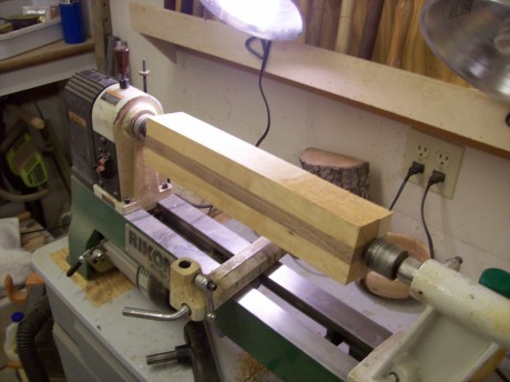 Mount between centers. I used a spur drive in the headstock and a live center in the tail stock.