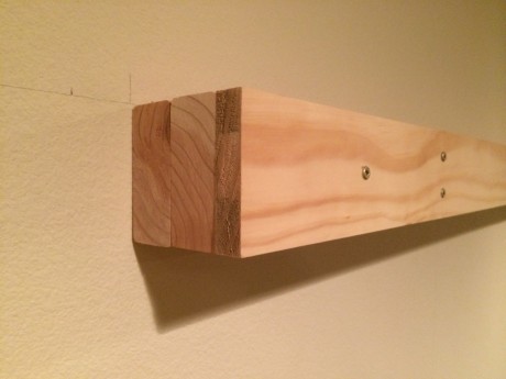 Here you can see why I call this a wood sandwich. Two 2X4's and a 3/4 inch wide trim board serve to bring the unit 3 3/4 inches from the wall.
