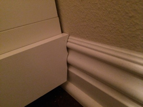 Remember how I lazily left the old baseboards on? Here I shaped the trim boards to conform to the old baseboards in an attempt to minimize the amount of caulk needed later.
