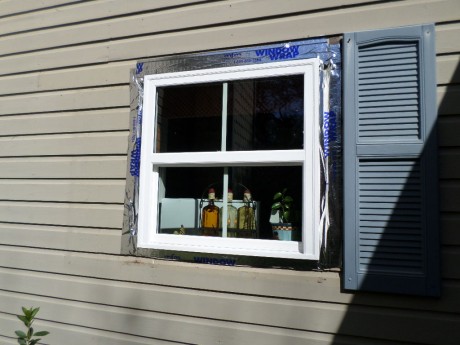 Window in, wrap in place and ready to cover up with 1x4's