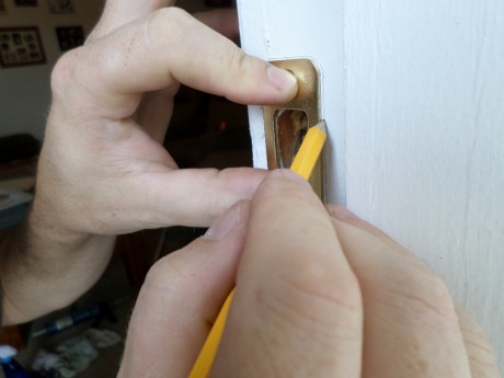 Aligning and scribing the striker plate