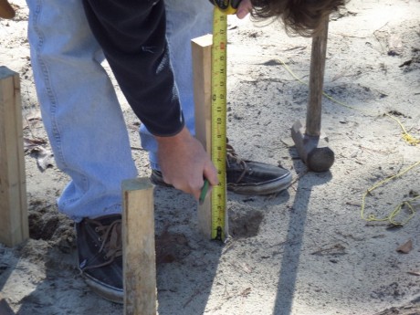 Measuring up six inches from the highest side of the garage